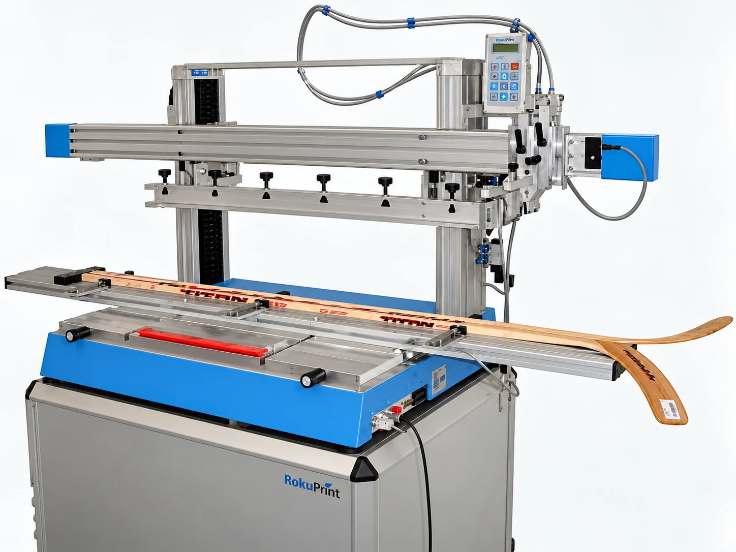 RokuPrint screen printing machine and fixture holding a hockey stick