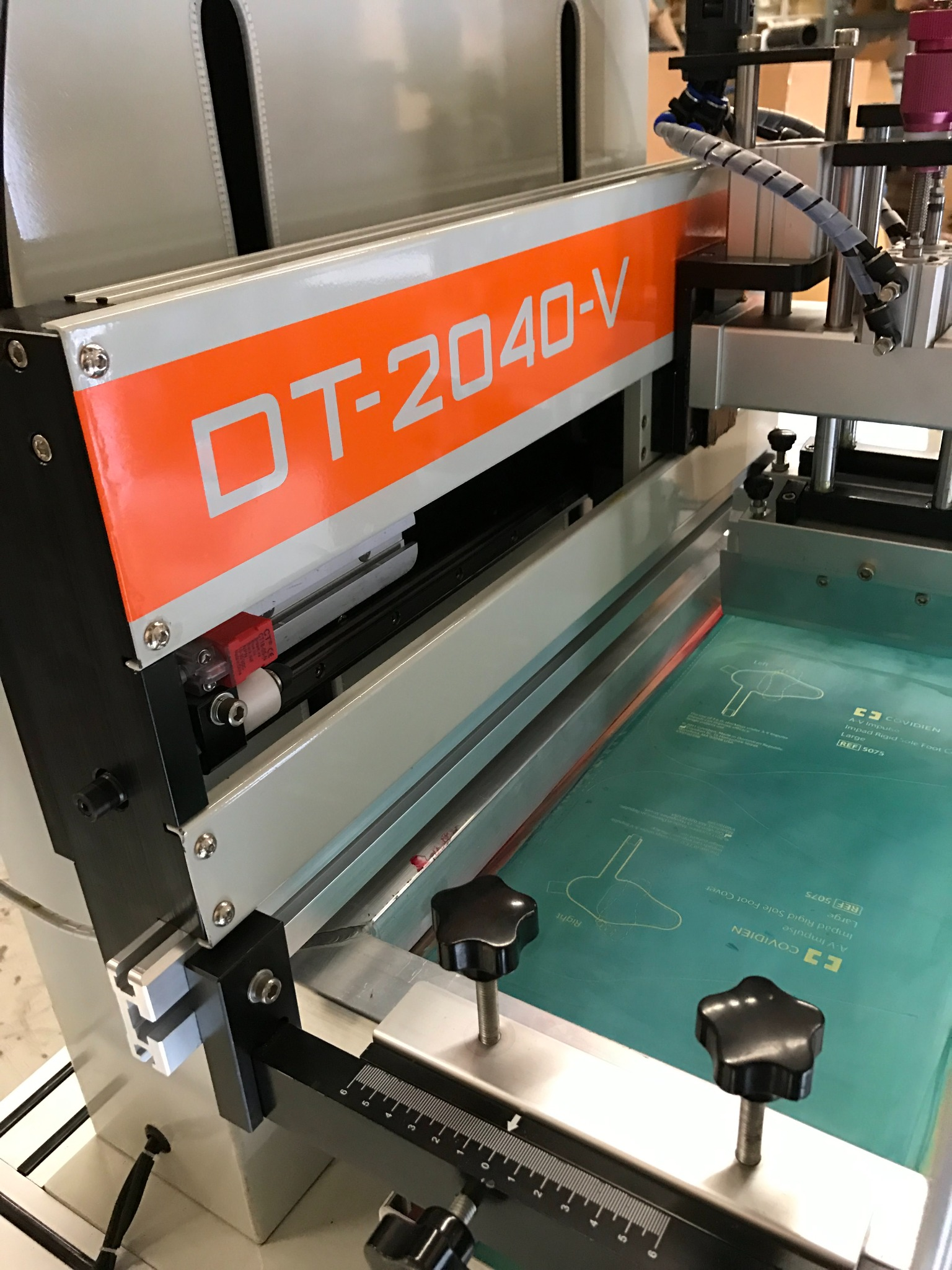 DT-2040 vertical lift flatbed screen printing press with screen frame raised