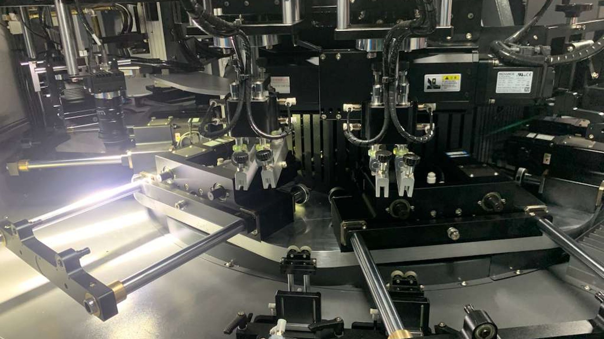 Actual DT-CNC print stations showing the screen assemblies, fixture positions and servo-controlled rotary platform