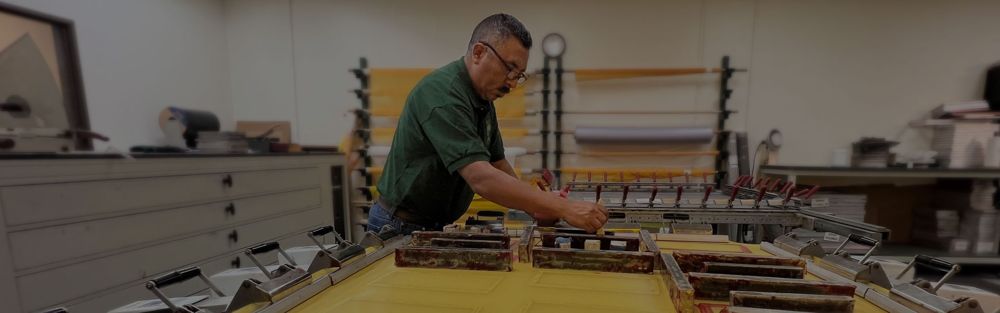 Deco Tech technician preparing a printing screen
